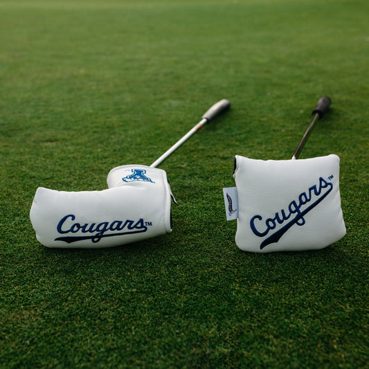 Two golf club covers with 'Cougars' branding on a grassy background